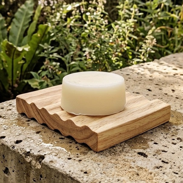 Elementary Skin Care Solid Conditioner bar on a bamboo eco-friendly soap dish